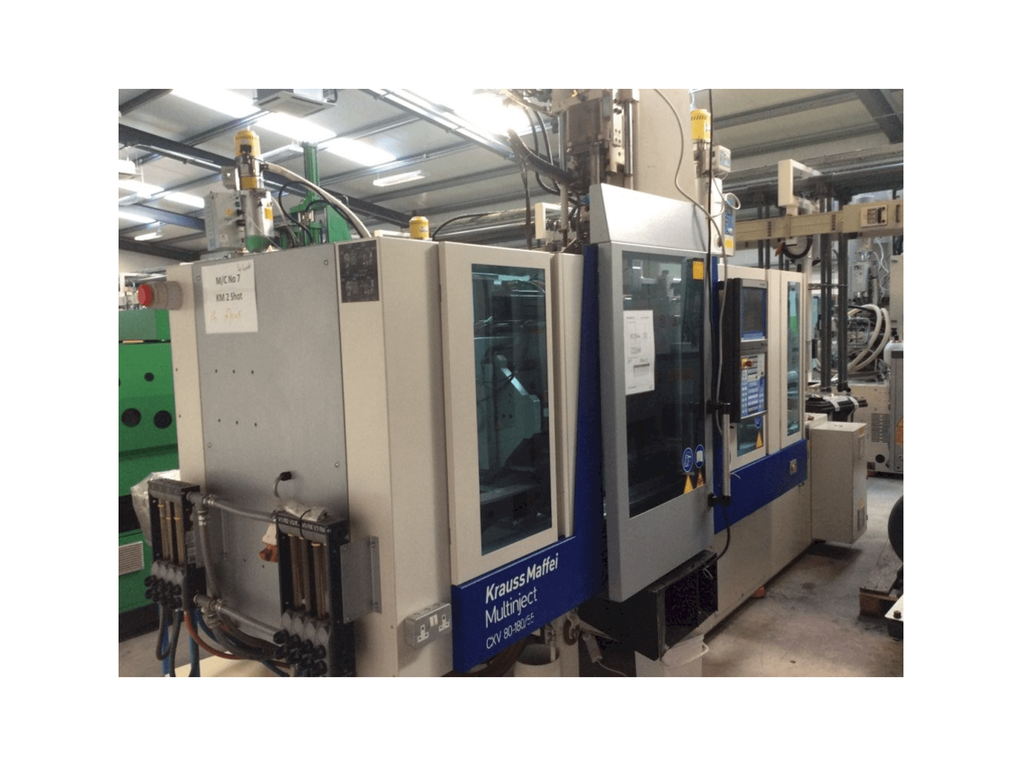 Front view of Krauss Maffei Multinject 80-180-55 CX V machine